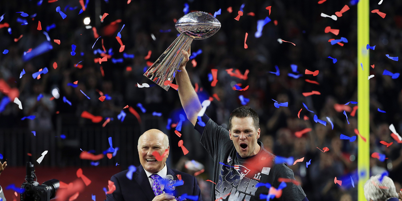 HOUSTON, TX - FEBRUARY 05: Tom Brady #12 of the New England Patriots celebrates with the Vince Lombardi Trophy after defeating the Atlanta Falcons 34-28 in overtime to win Super Bowl 51 at NRG Stadium on February 5, 2017 in Houston, Texas.   Mike Ehrmann/Getty Images/AFP